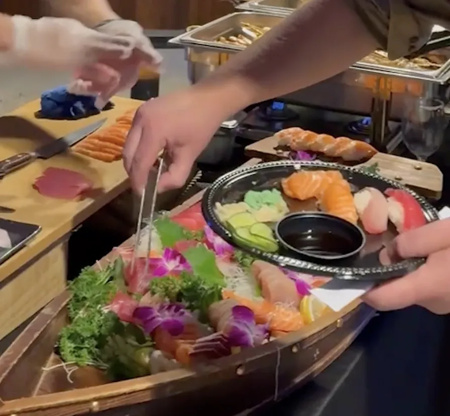Chef serving fresh sushi